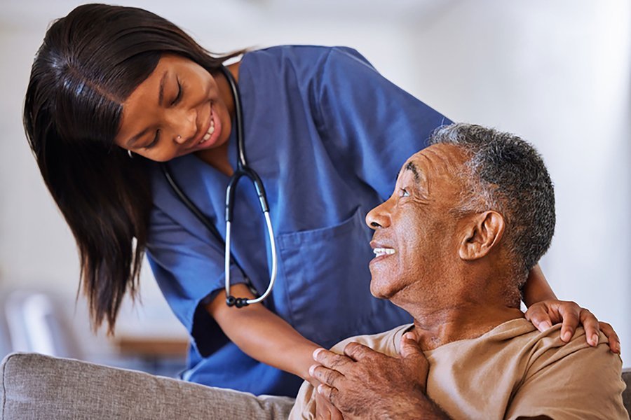 Unicolive caregiver assisting elderly patient